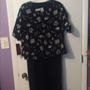 Long sleeveless black dress with jacket.